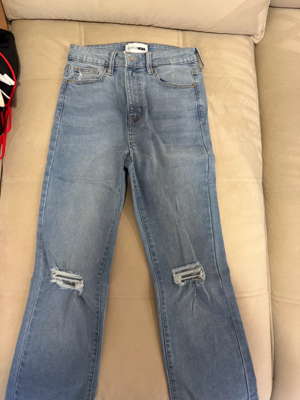 Fashion Nova Light Blue Flare Jeans with Knee Rips. Small